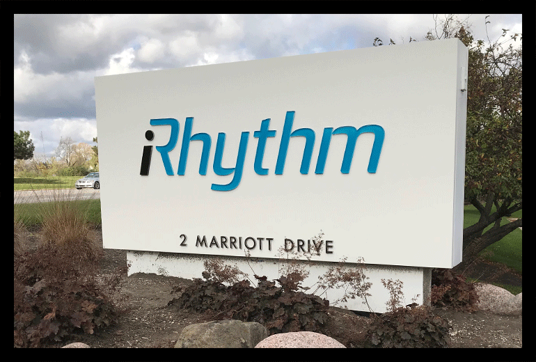 iRhythm illuminated sign shown during the day