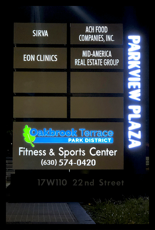 Parkview Plaza illuminated sign at night