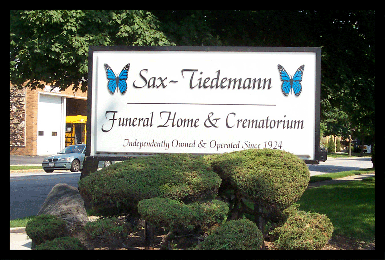 illuminated funeral home sign showin during the day