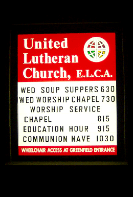 illuminated church sign shown at night